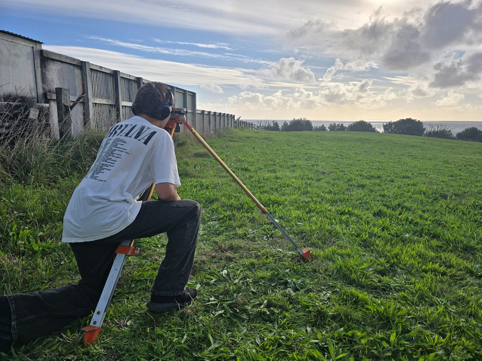 GNSS RTK base station and rover on a tripod in a paddock in Taranaki