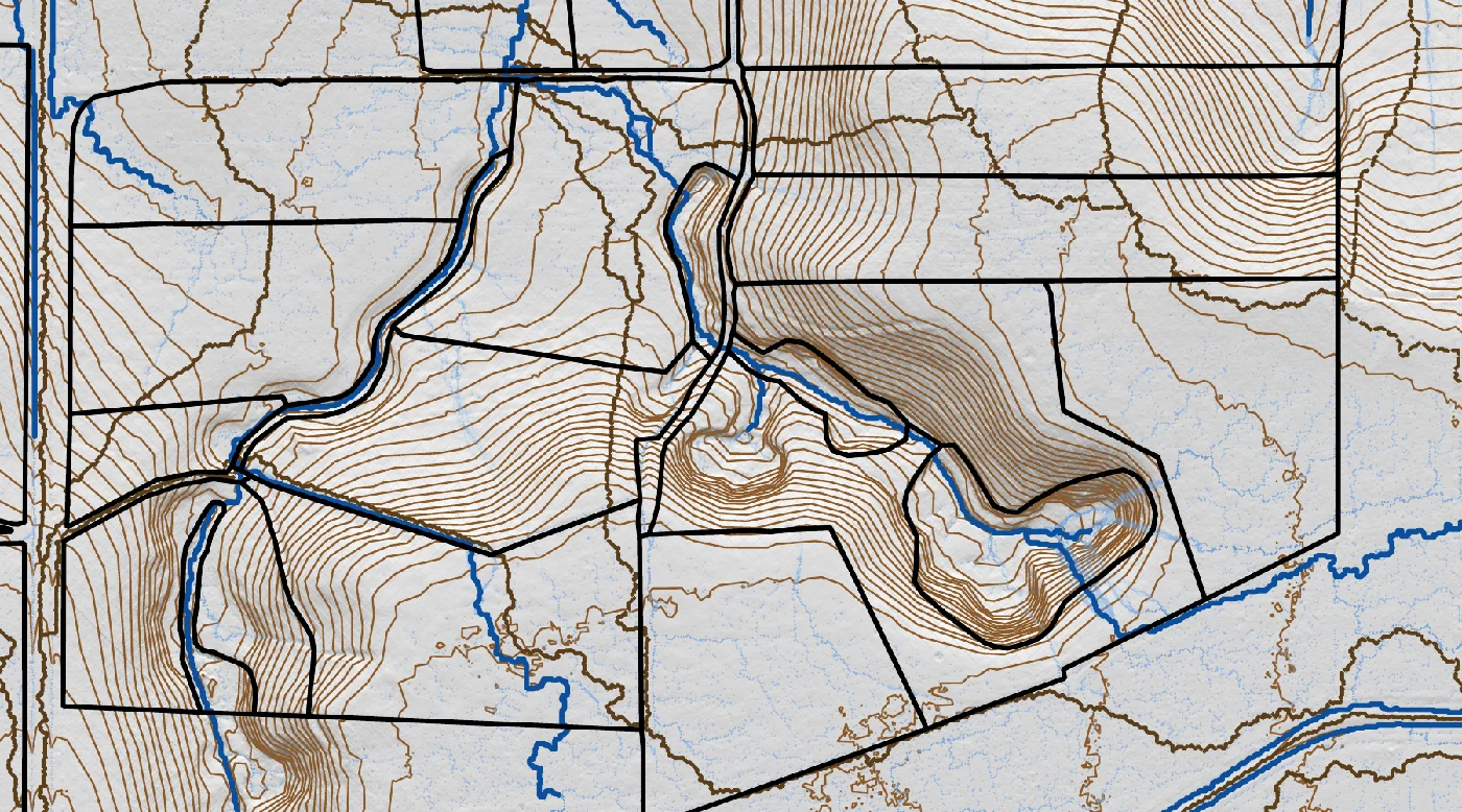 Close-up of the farm drainage study: blue modelled flow paths running down the gullies into two reserve ponds, over brown one-metre LiDAR contours and black paddock boundaries
