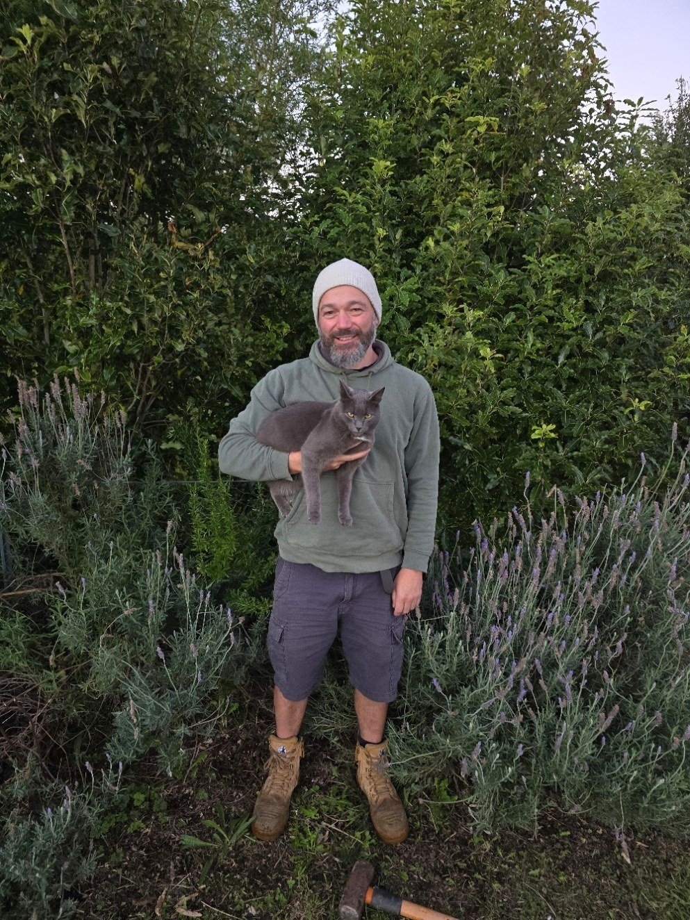 Sam Kirk of Geomap NZ, drone pilot and mapper, in a garden in Okato, Taranaki